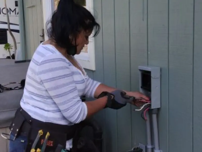 Licensed electrician wiring an exterior subpanel in Fort Riley